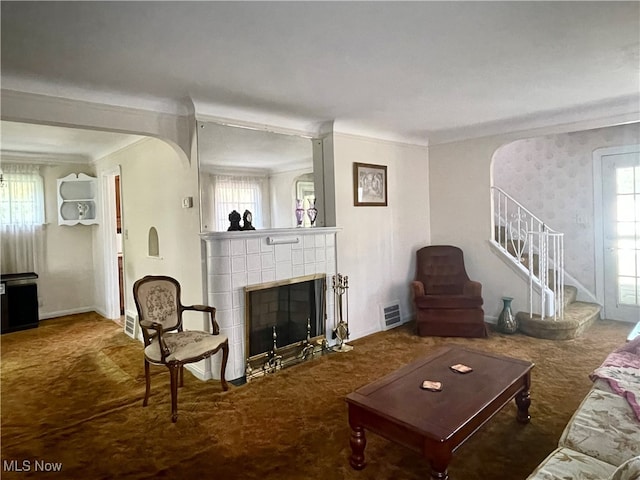 living room with carpet floors and crown molding