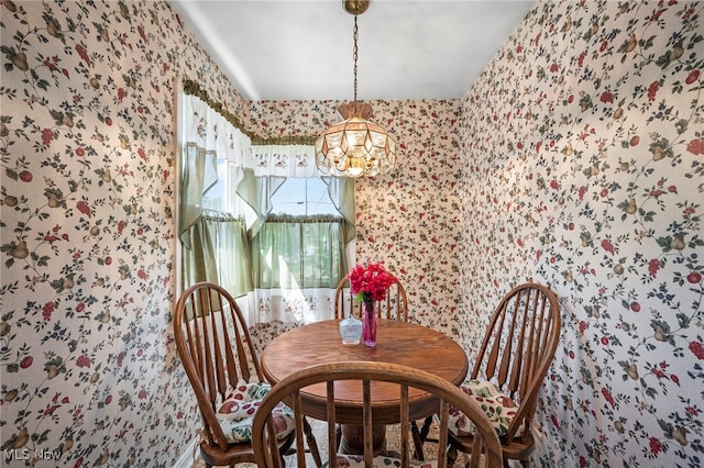 dining space featuring a notable chandelier