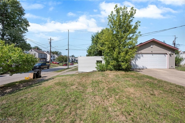 exterior space with a garage and a front yard