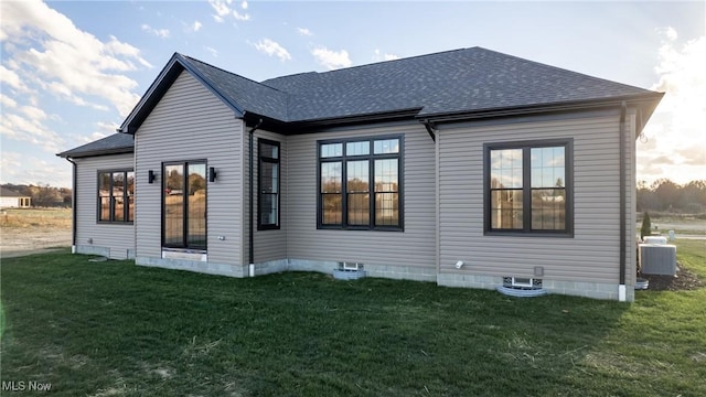 6120 Century Blvd, Canfield, OH 44406 - rear view of house with cooling unit, a lawn, and a shingled roof