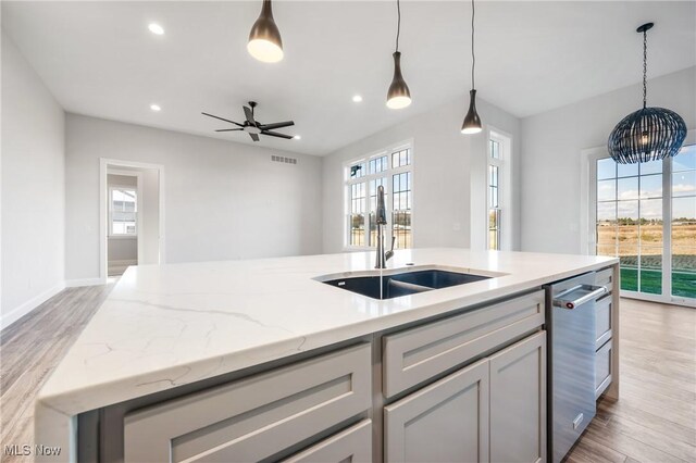 6120 Century Blvd, Canfield, OH 44406 - kitchen featuring a sink, light wood-style floors, recessed lighting, an island with sink, and a ceiling fan