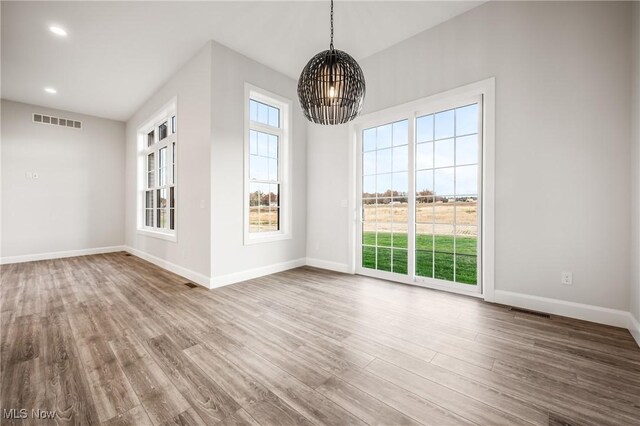 6120 Century Blvd, Canfield, OH 44406 - unfurnished dining area featuring a chandelier, wood finished floors, baseboards, and recessed lighting