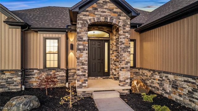 6120 Century Blvd, Canfield, OH 44406 - doorway to property featuring stone siding and roof with shingles