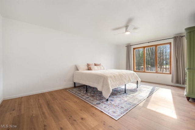 bedroom featuring light hardwood / wood-style floors and ceiling fan