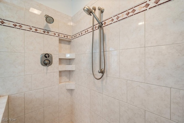 bathroom featuring tiled shower