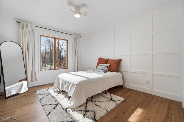 bedroom featuring light hardwood / wood-style flooring and ceiling fan