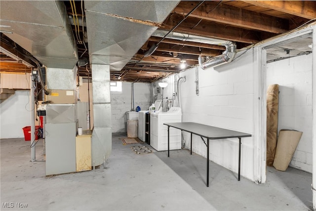 basement with washing machine and clothes dryer