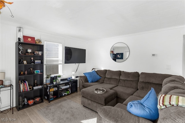 living room with ornamental molding and hardwood / wood-style flooring