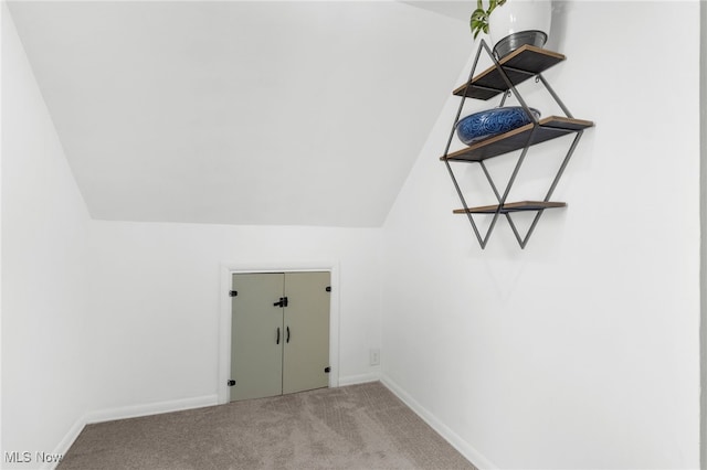 laundry area featuring light carpet