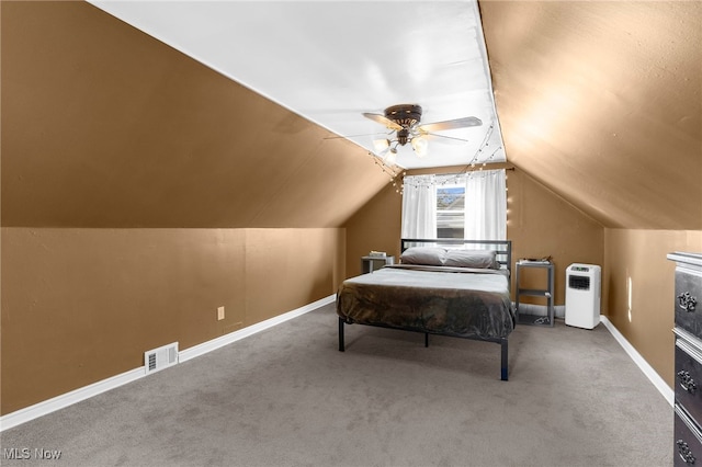 carpeted bedroom with ceiling fan and lofted ceiling