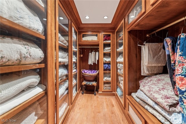 mudroom featuring light hardwood / wood-style floors and crown molding