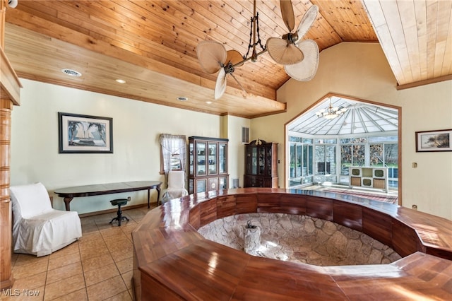 interior space featuring light tile patterned floors, vaulted ceiling, ceiling fan, and wood ceiling