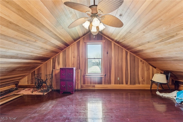 bonus room featuring dark hardwood / wood-style flooring, wood ceiling, vaulted ceiling, ceiling fan, and wood walls