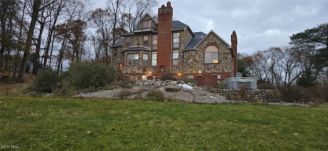 rear view of house with a lawn