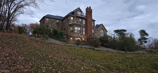 view of home's exterior featuring a lawn