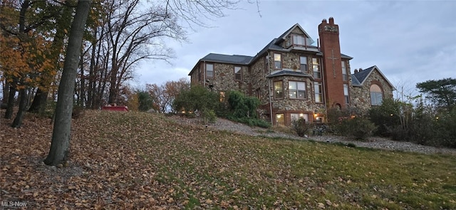 view of home's exterior with a lawn