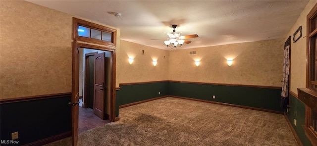 carpeted empty room featuring ceiling fan