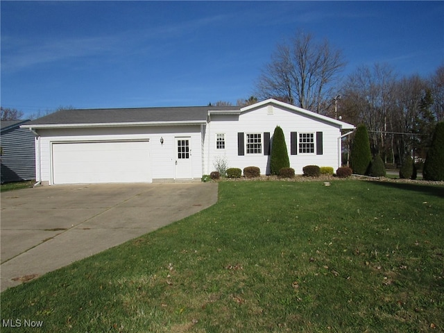 single story home with a front yard and a garage