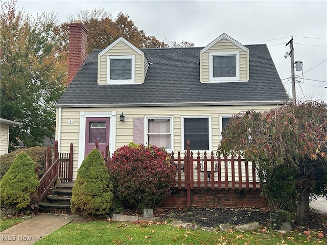 view of new england style home