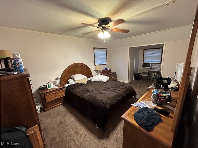 carpeted bedroom featuring ceiling fan and crown molding