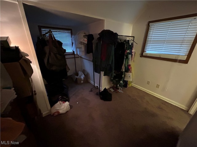 bedroom featuring dark colored carpet