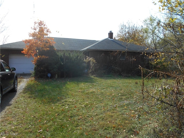 view of yard with a garage