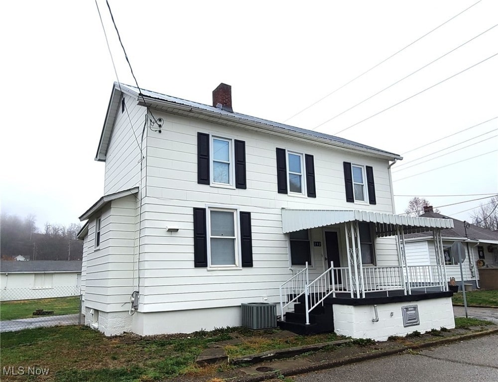 view of front of property featuring central AC unit