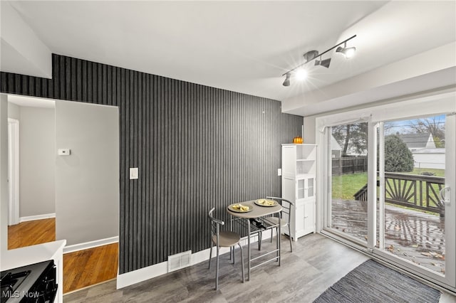 dining space featuring hardwood / wood-style flooring