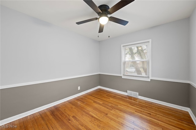 unfurnished room with ceiling fan and light hardwood / wood-style flooring