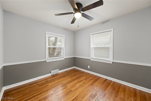 spare room featuring ceiling fan and wood-type flooring