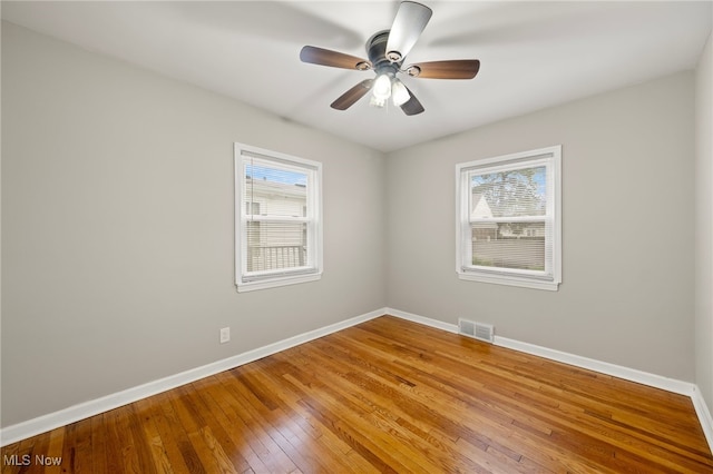 spare room featuring ceiling fan and wood-type flooring