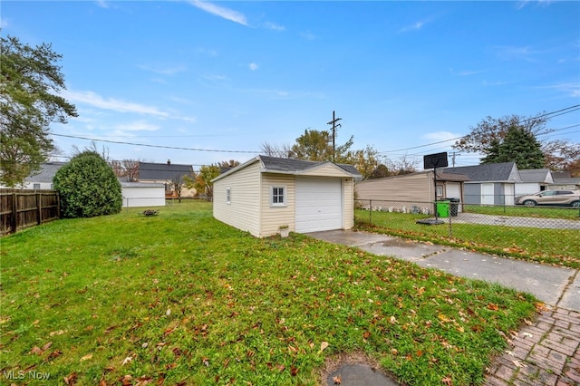 view of yard with a garage and an outdoor structure