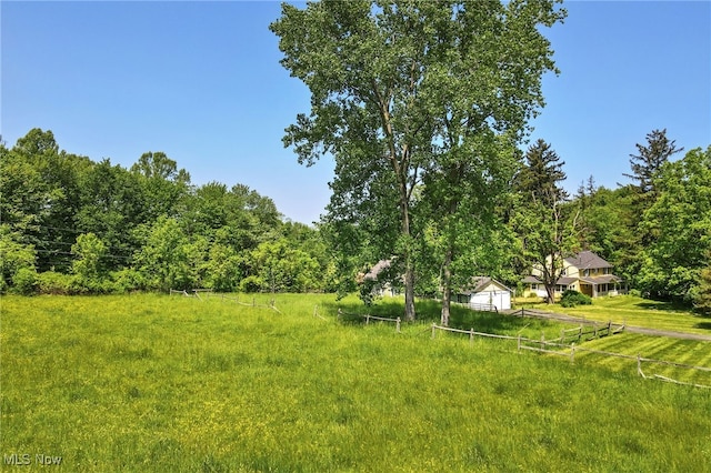 view of yard with a rural view