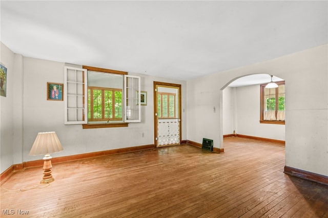 spare room with hardwood / wood-style floors