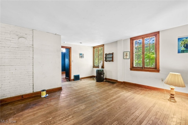 unfurnished room featuring hardwood / wood-style floors