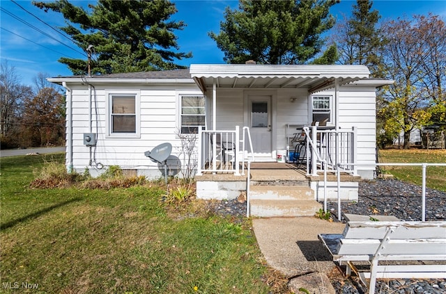 view of front of home featuring a front lawn and a porch