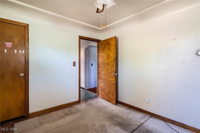 carpeted empty room with ceiling fan