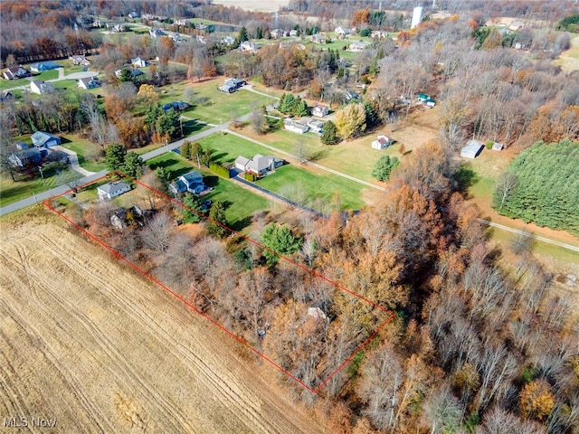 birds eye view of property with a rural view