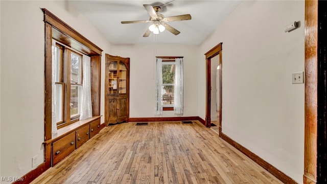 interior space with light hardwood / wood-style floors and ceiling fan