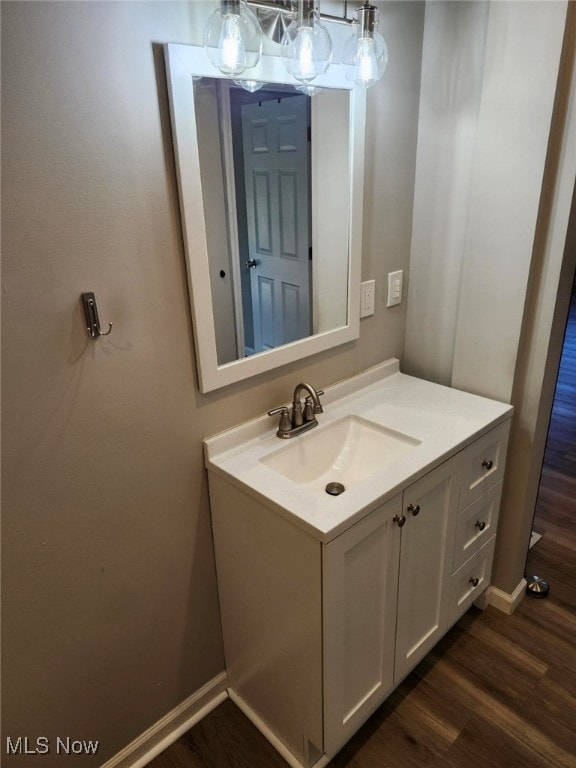 bathroom featuring vanity and hardwood / wood-style flooring