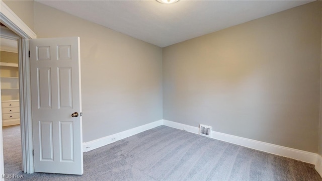 empty room featuring carpet flooring