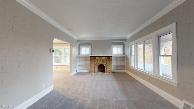 unfurnished living room featuring carpet, ornamental molding, and a brick fireplace