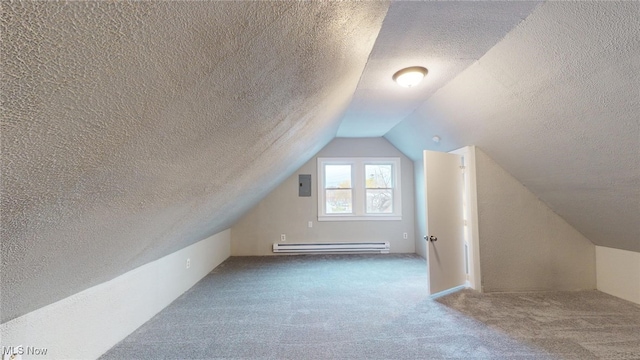 additional living space with carpet flooring, lofted ceiling, a baseboard radiator, and a textured ceiling