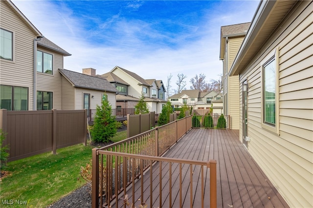 wooden deck with a lawn