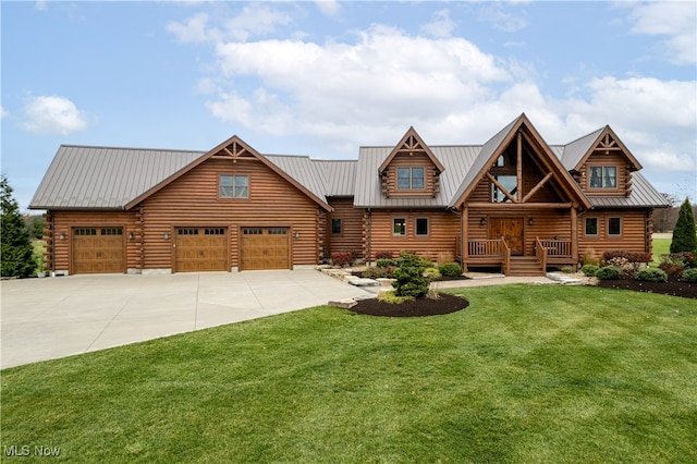 log-style house featuring a garage and a front lawn