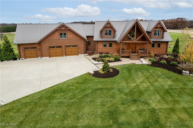 log-style house with a front lawn and a garage