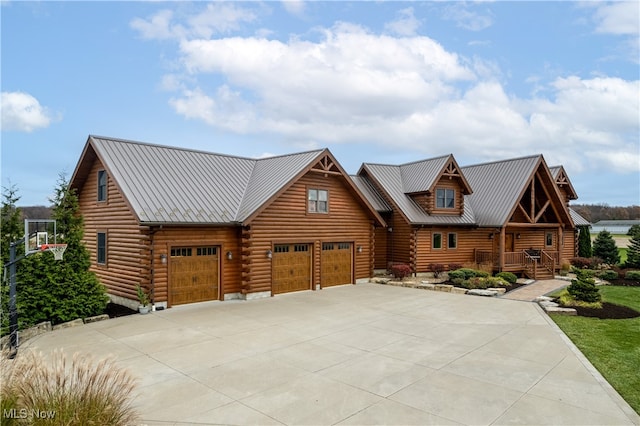 log home featuring a garage