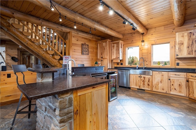 kitchen with wood walls, sink, beamed ceiling, and wood ceiling