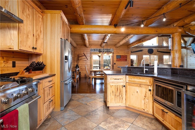 kitchen featuring appliances with stainless steel finishes, hanging light fixtures, and wooden ceiling