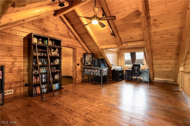 unfurnished office featuring ceiling fan, wooden ceiling, vaulted ceiling with beams, wood walls, and hardwood / wood-style floors